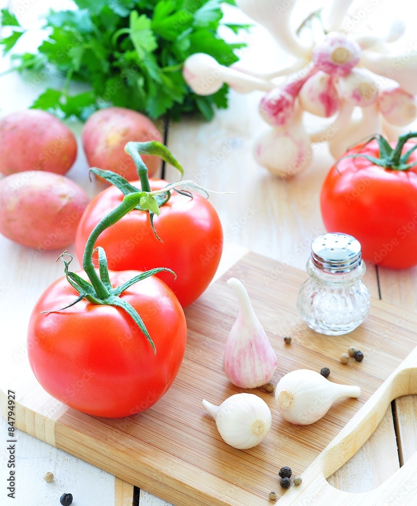 fresh vegetables - tomatoes, garlic, potatoes and parsley fresh vegetables - tomatoes, garlic, potatoes and parsley