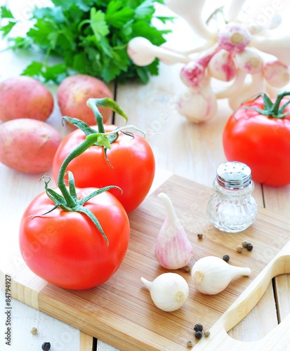 fresh vegetables - tomatoes, garlic, potatoes and parsley