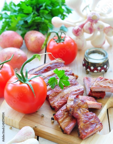 fresh vegetables, tomatoes, garlic, potatoes and parsley with smoked pork ribs