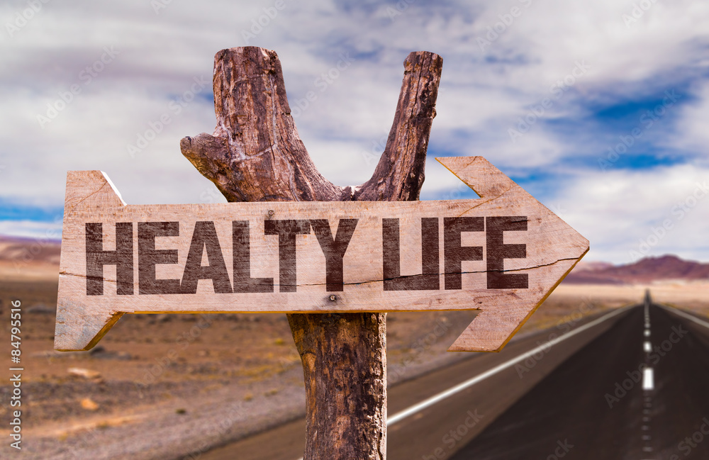 Healthy Life direction sign with road background