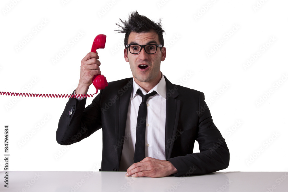 Naklejka premium surprised businessman with red phone