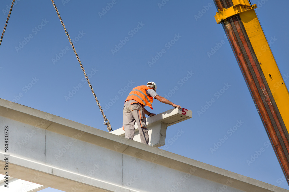 Height worker placing truss in skeleton