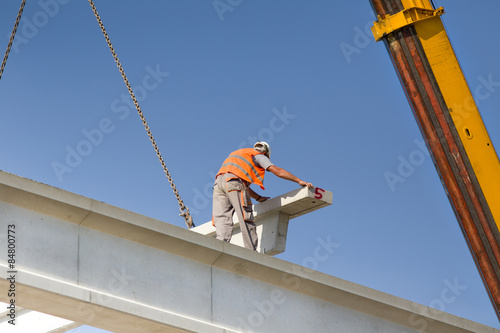 Height worker placing truss in skeleton © Budimir Jevtic