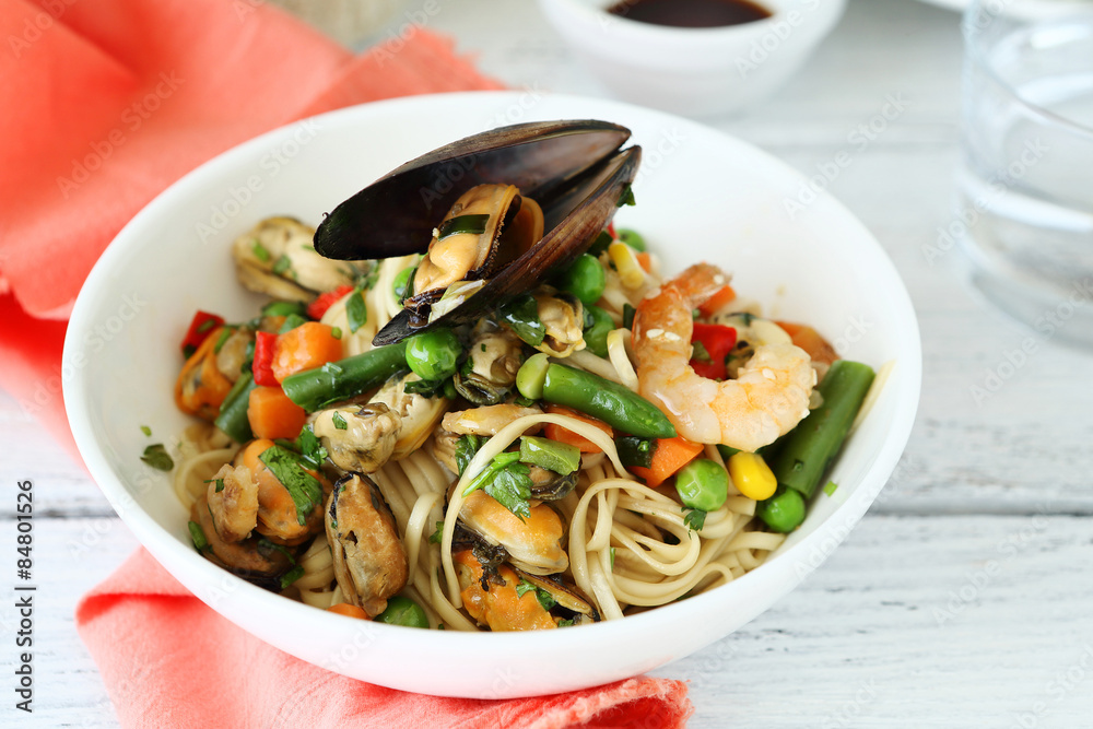 Noodles with vegetables and seafood in a bowl Noodles with vegetables and seafood in a bowl
