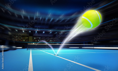tennis ball ace strike on a blue court in motion blur photo