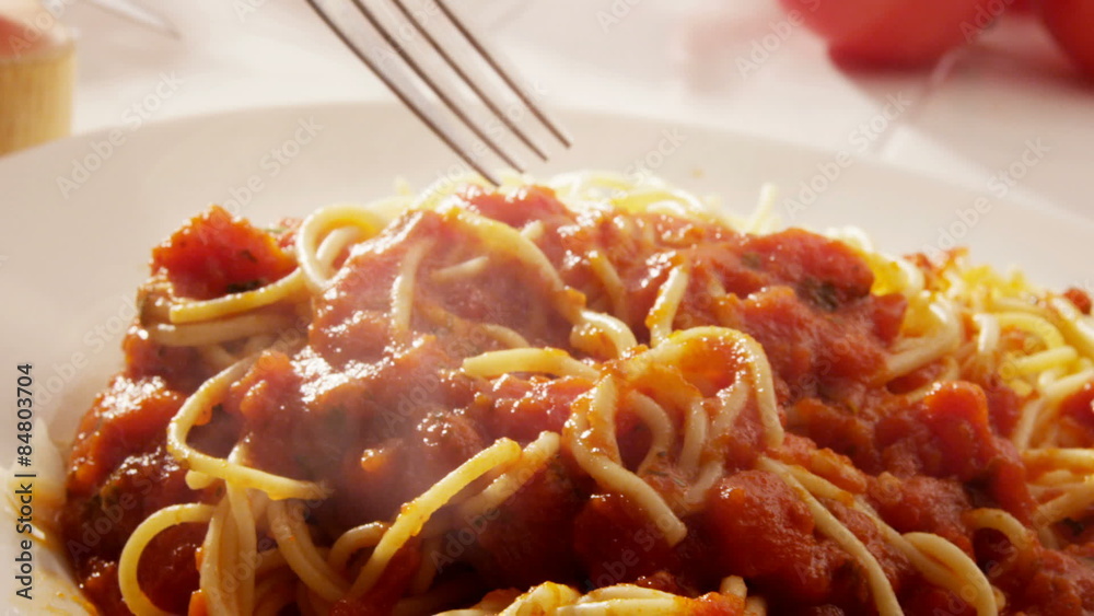 Eating plate of spaghetti