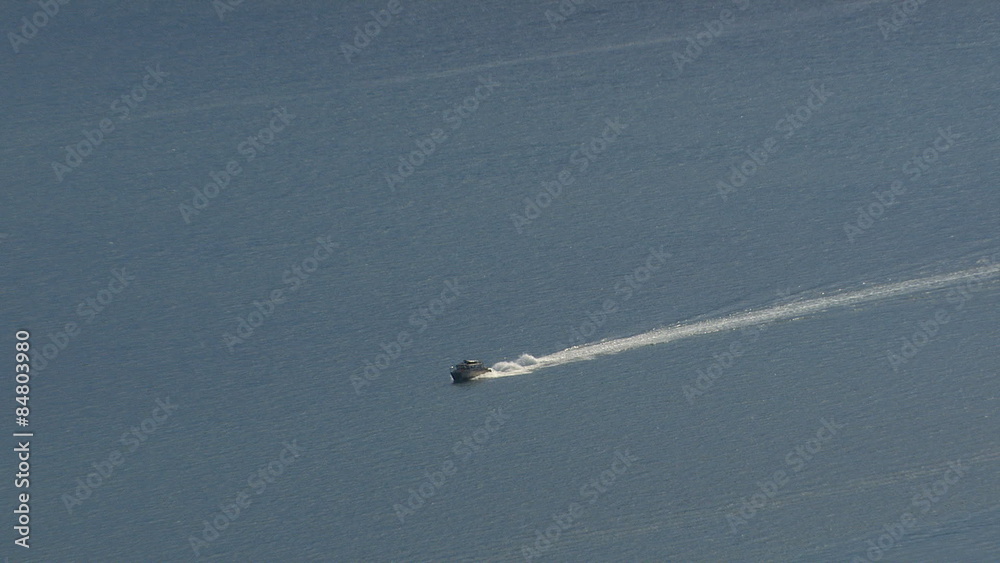 Aerial shot of boat in Alaska strait. Zoom out. Aerial shot of boat in Alaska strait. Zoom out.