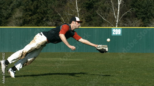 Baseball player catching ball, slow motion