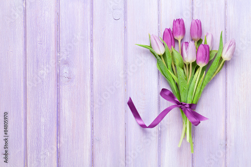 Purple tulips over wooden table #84805970