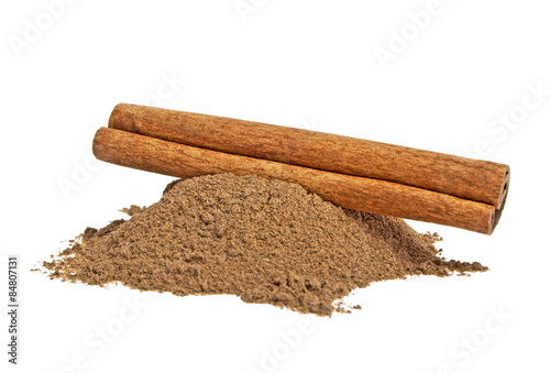 Cinnamon stick and powder on white background