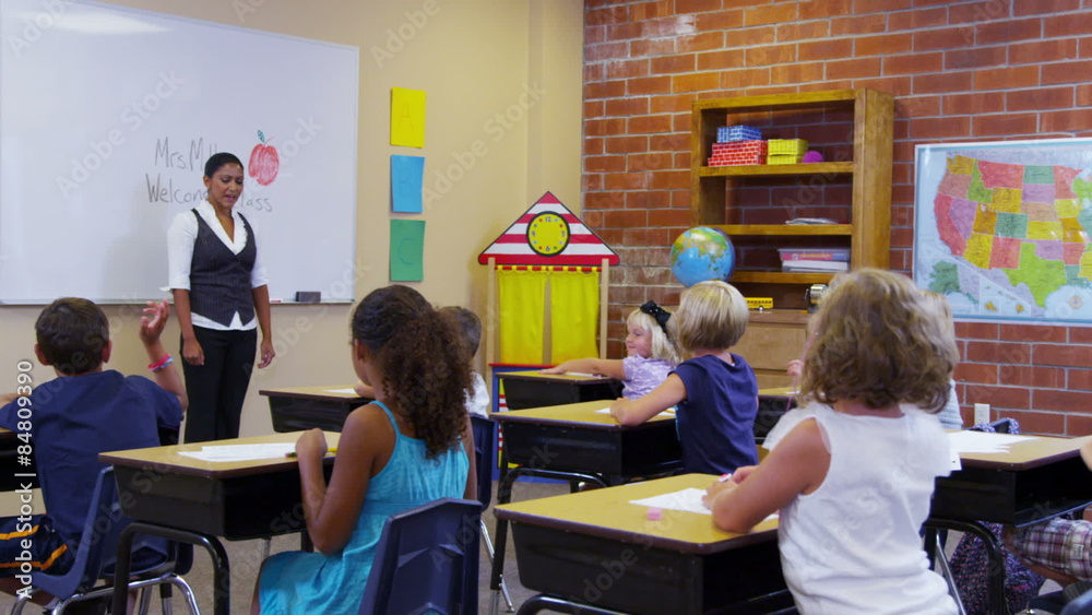 School teacher asks elementary students questions School teacher asks elementary students questions
