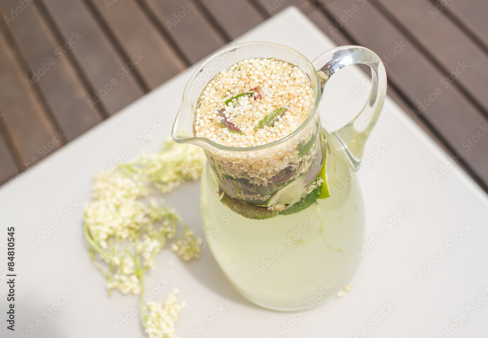 Summer cold drink with elder berry and lime
