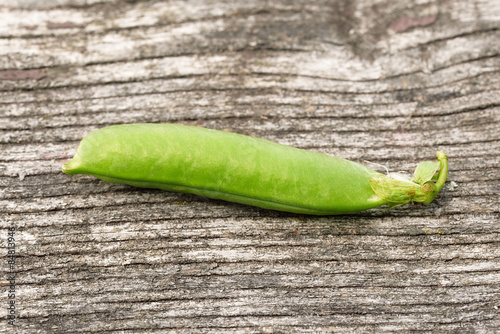 Fresh peas on wooden background