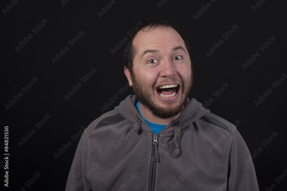 Obraz premium man laughing out loud isolated on black background