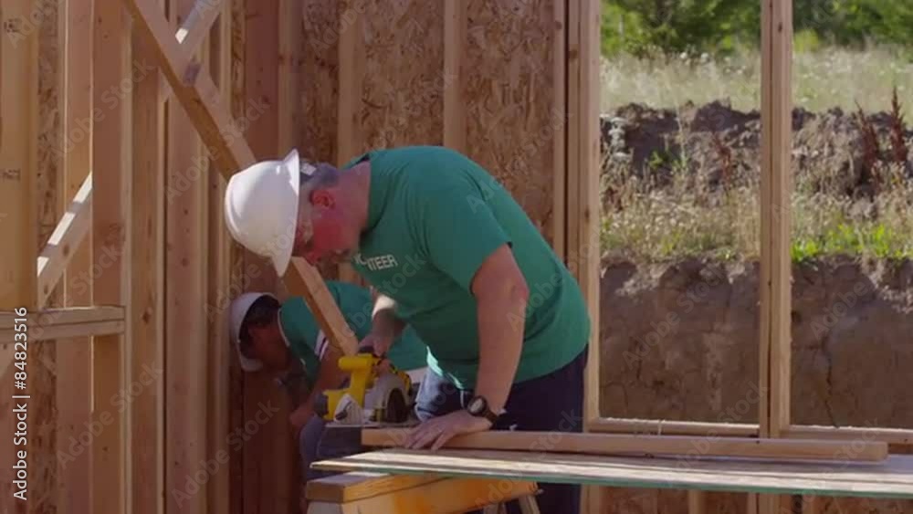Volunteers working together on construction project