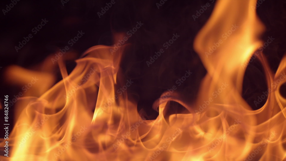 Closeup of fire burning on black background in slow motion