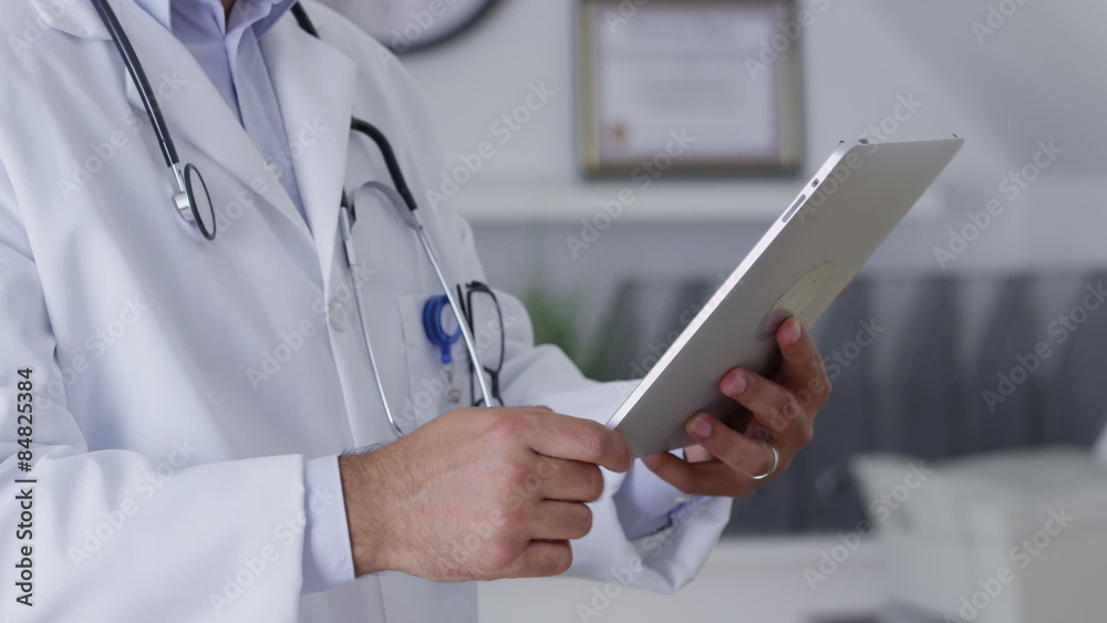 Closeup of doctor using digital tablet Closeup of doctor using digital tablet