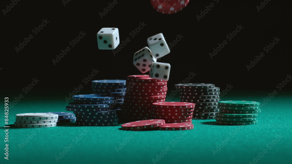 Dice and poker chips falling in slow motion