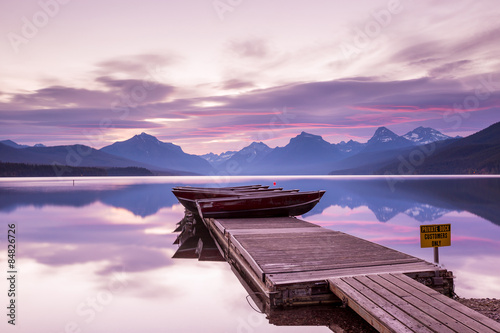 Boats sit on the dock at Lake McDonald photo