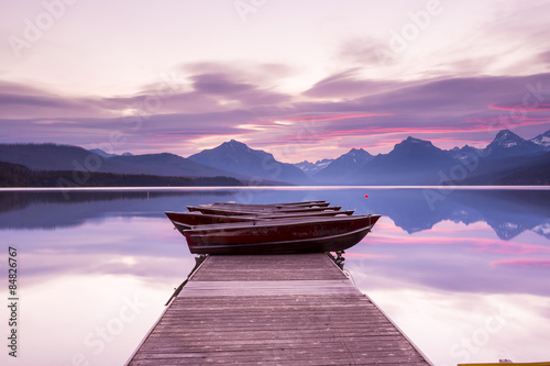 Boats sit on the dock at Lake McDonald photo