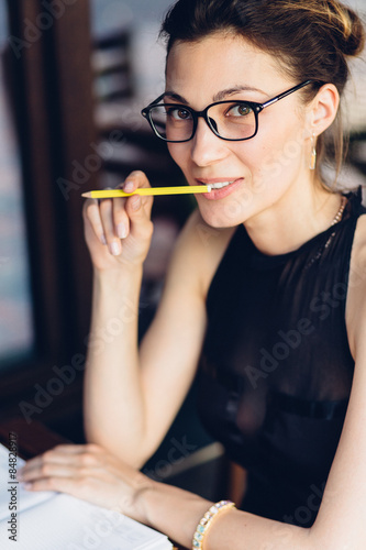 Attractive girl with a notepad