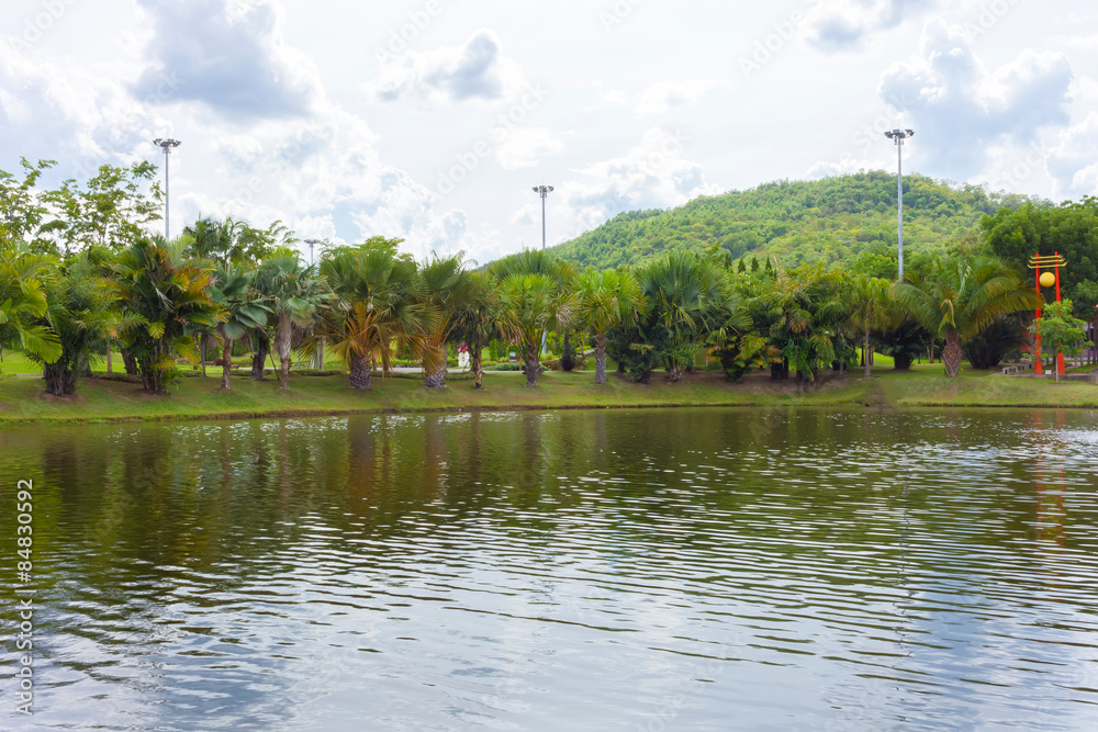 Obraz premium Spring landscape with lake and single chair