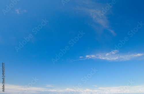 plumose clouds in the blue sky