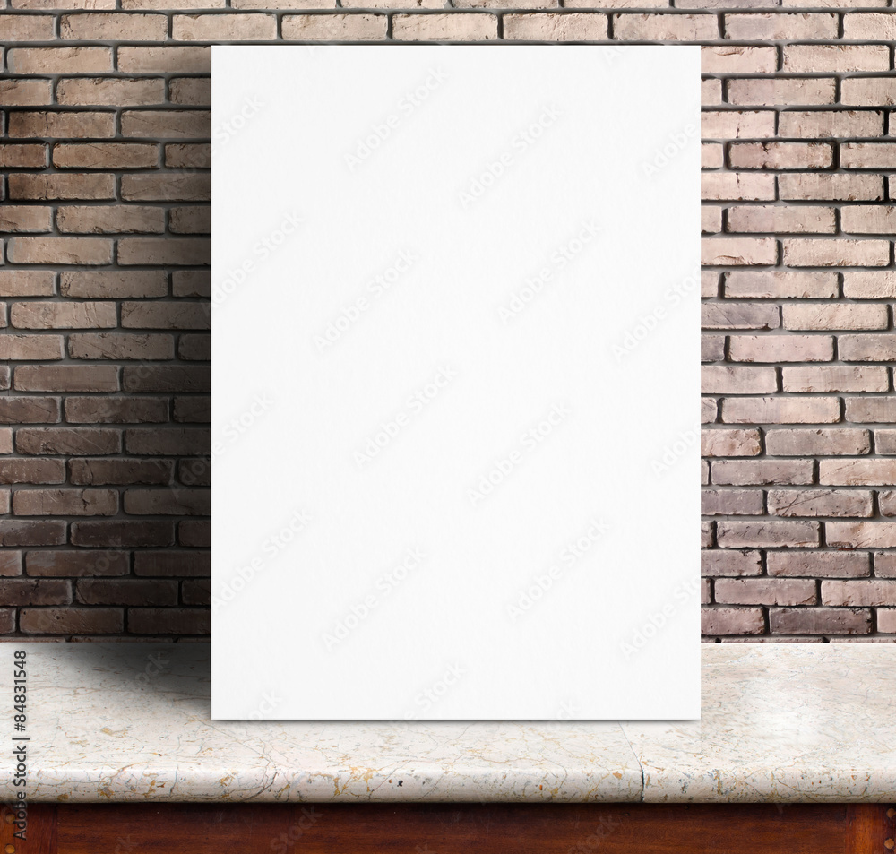 Black White paper poster lean at red brick wall and marble table