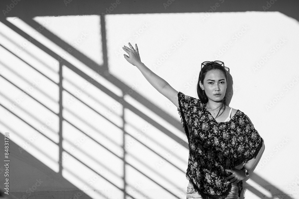 Fototapeta premium Young woman outdoors portrait. Black and white colors.