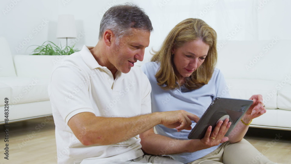 Mature couple using digital tablet Mature couple using digital tablet