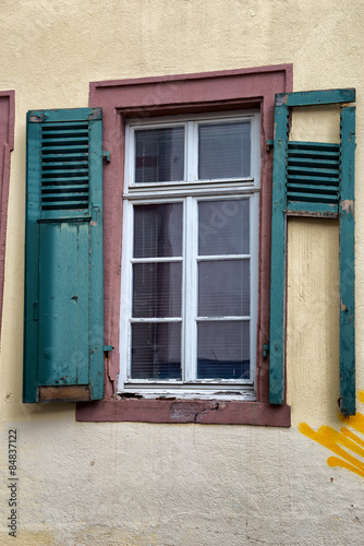 Detail of Window with Broken Green Shutters