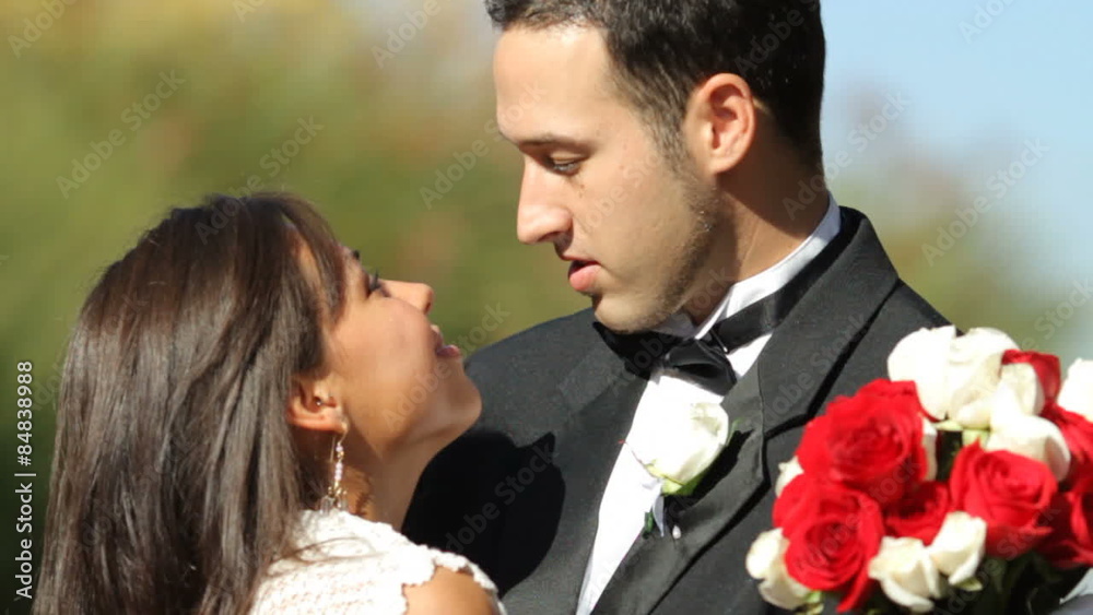 Bride and groom at wedding kiss Bride and groom at wedding kiss