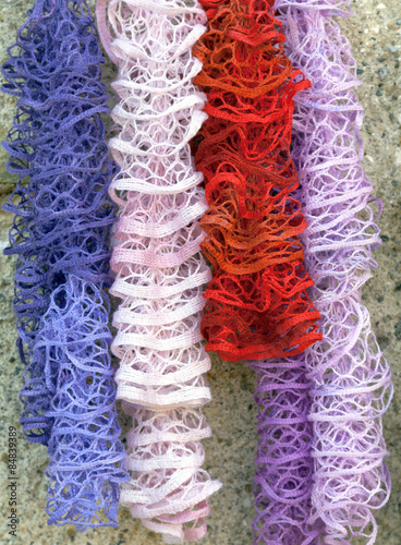 Colorful hanging scarves. Color image