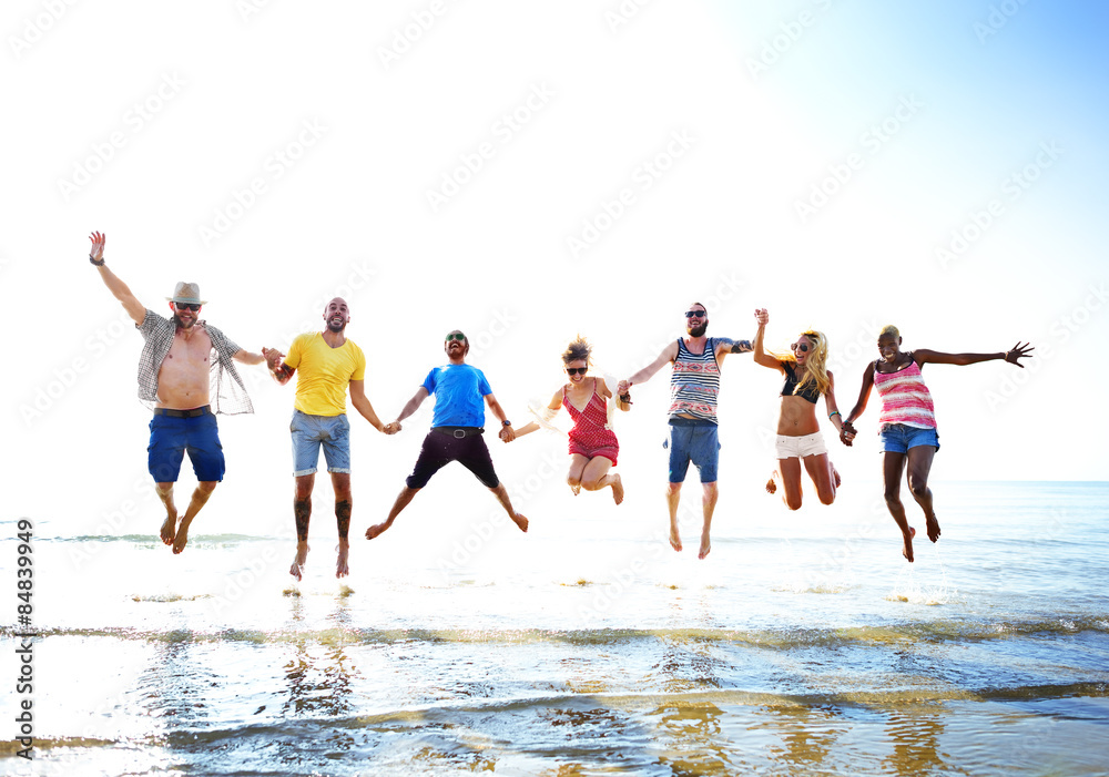 Obraz premium Diverse Beach Summer Friends Fun Jump Shot Concept