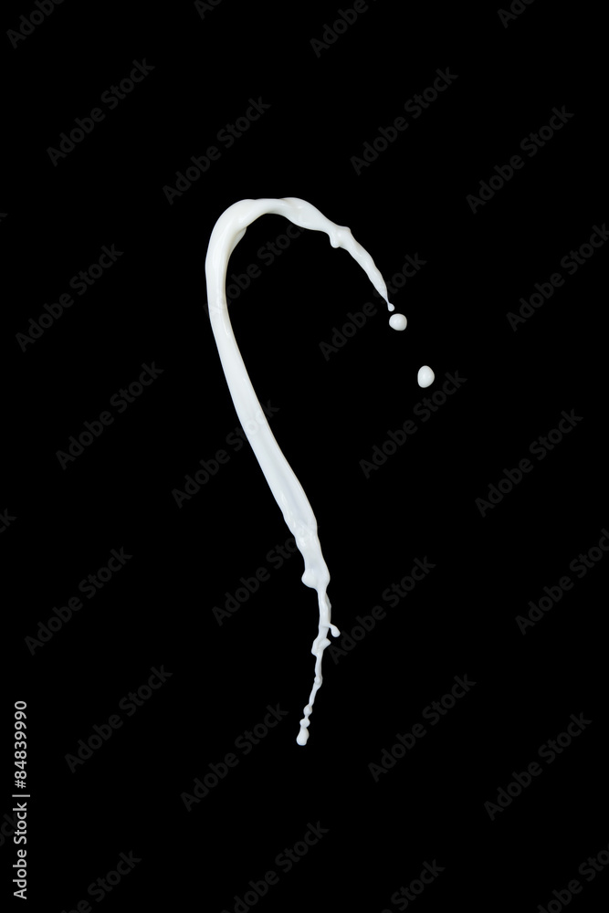 splash of milk on black background splash of milk on black background