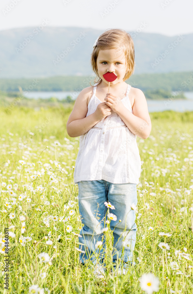 cute little girl in the chamomile field in spring cute little girl in the chamomile field in spring