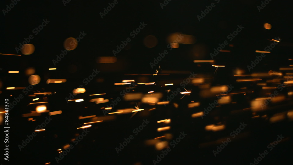 Sparks on black background, slow motion