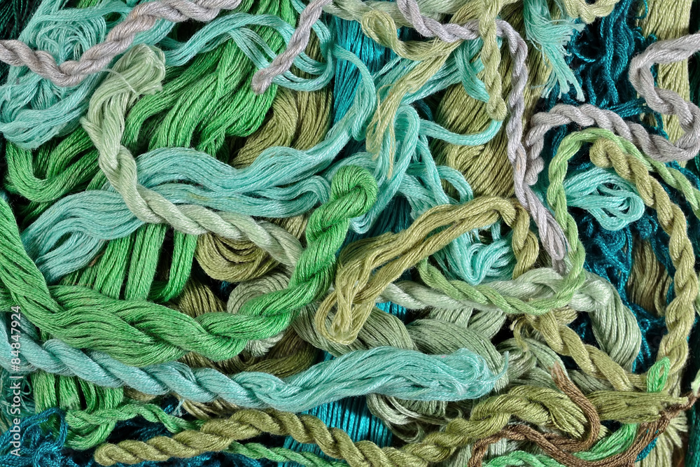 Colorful embroidery floss as background texture close up