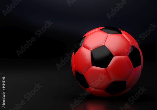 Red soccer ball with reflection