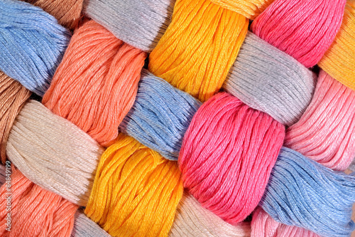 Colorful twisted skeins of floss as background texture