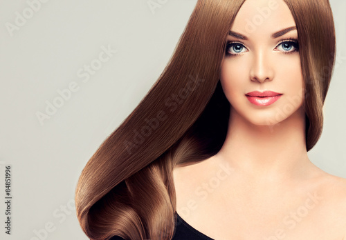 Beautiful girl with brown hair .Long straight hair Shine 
