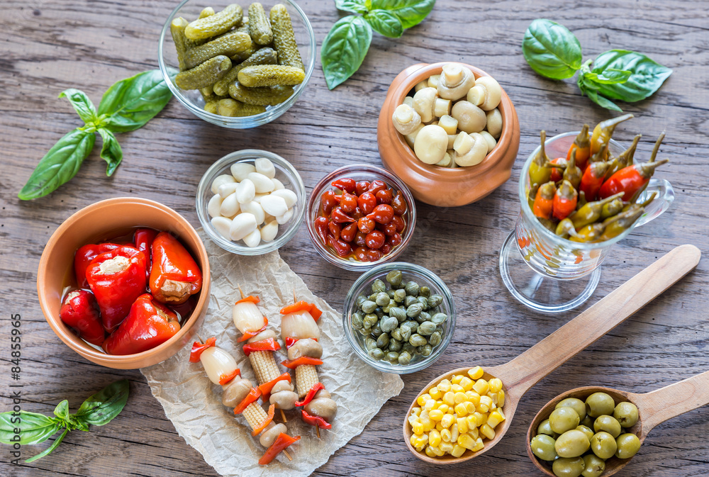 Pickled vegetables on the wooden background Pickled vegetables on the wooden background