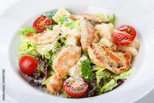 Restaurant food closeup - salad with roasted chicken fillet and