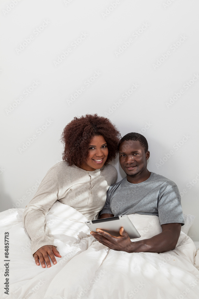 African couple using the computer African couple using the computer