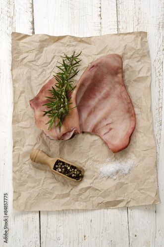 raw pig ear on brown kitchen paper