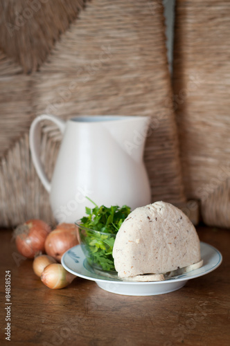 goat cheese with parsley and onion photo