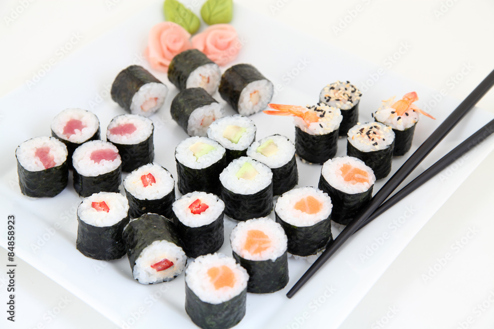 sushi set on white plate. Traditional japanese sushi rolls sushi set on white plate. Traditional japanese sushi rolls