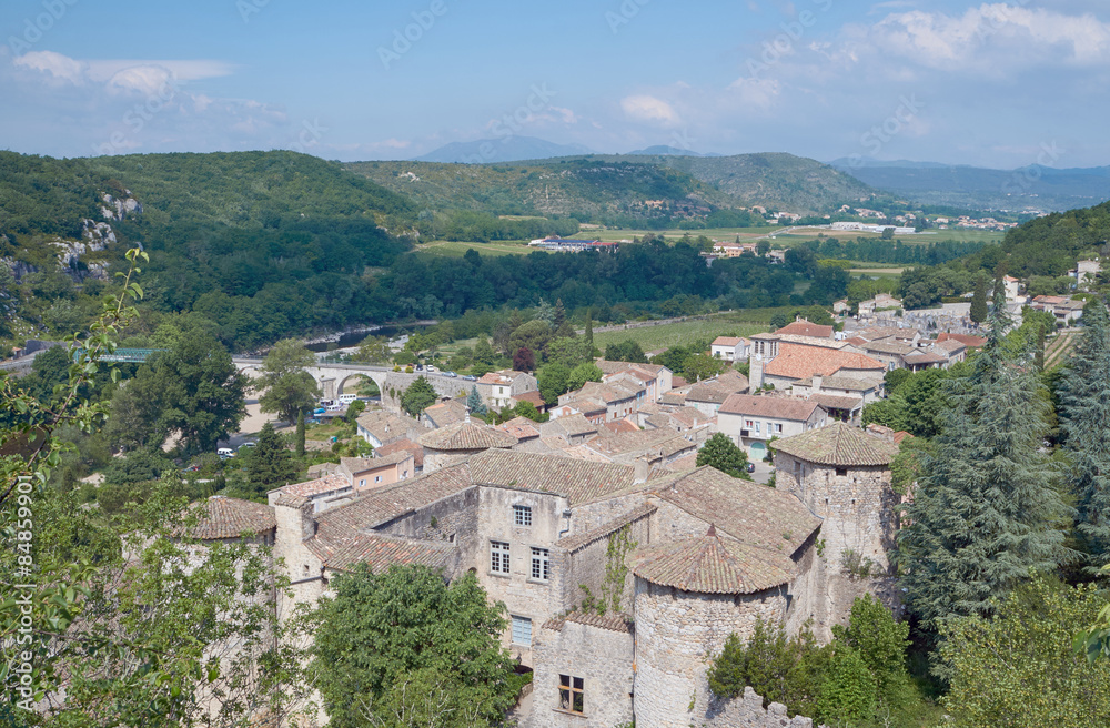 The medieval town of Vogue over the River Ardeche in France.