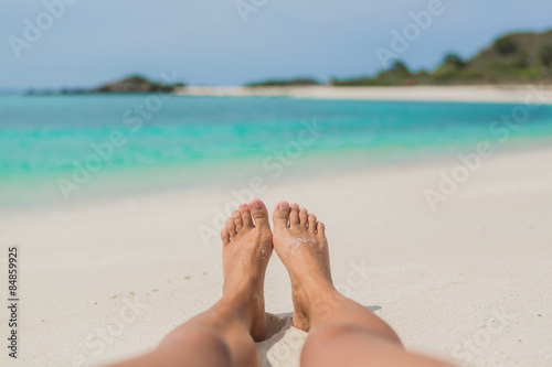 Woman's Bare Feet on the beach.