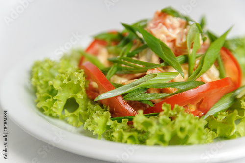 Vegetable salad with tomatoes, lettuce, green onions and mushroo